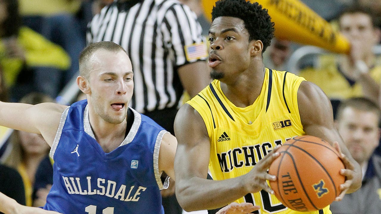 No. 24 Michigan eases past Hillsdale after raising banner